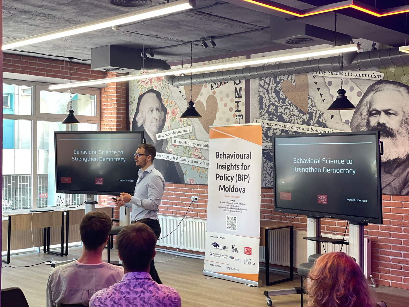 Joseph Sherlock presenting research on behavioural science and democracy